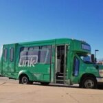 Transit shuttle parked at a stop