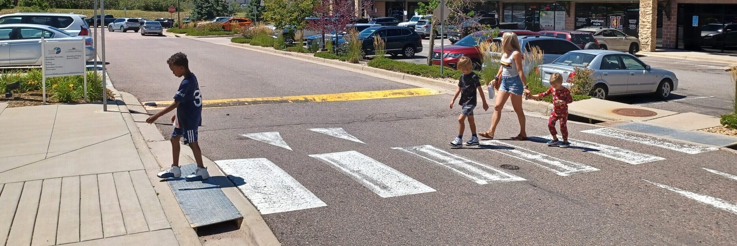 Kids crossing sidewalk at Village Square Drive