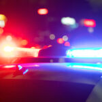 Red and blue light flasher. Police car at night time in the city