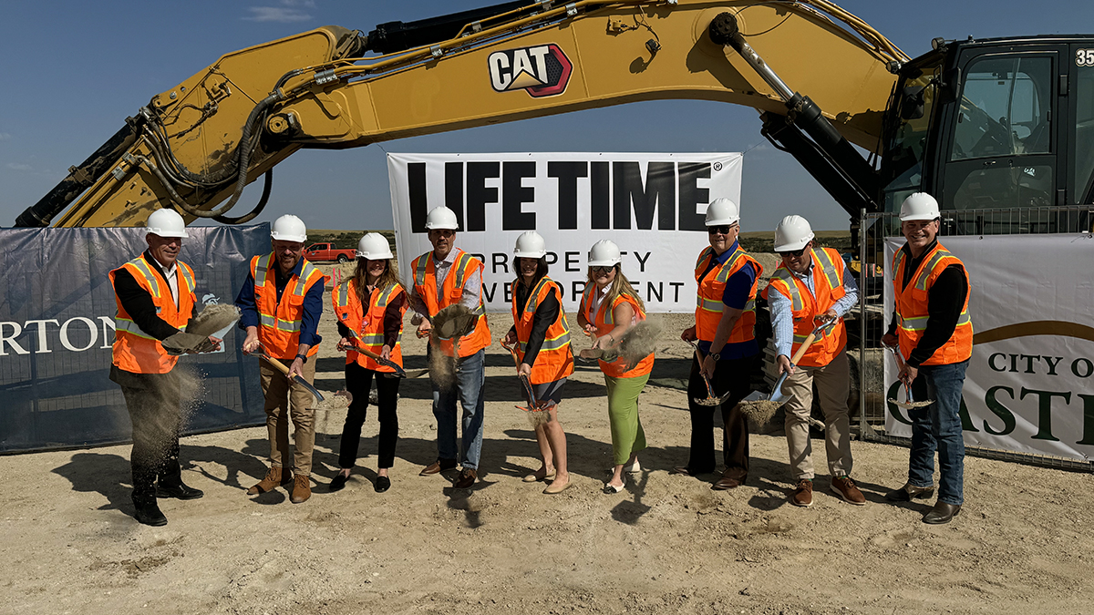 Members of City Council and the Castle Pines City Manager participating in a ceremonial groundbreaking at the construction site of the new Life Time.