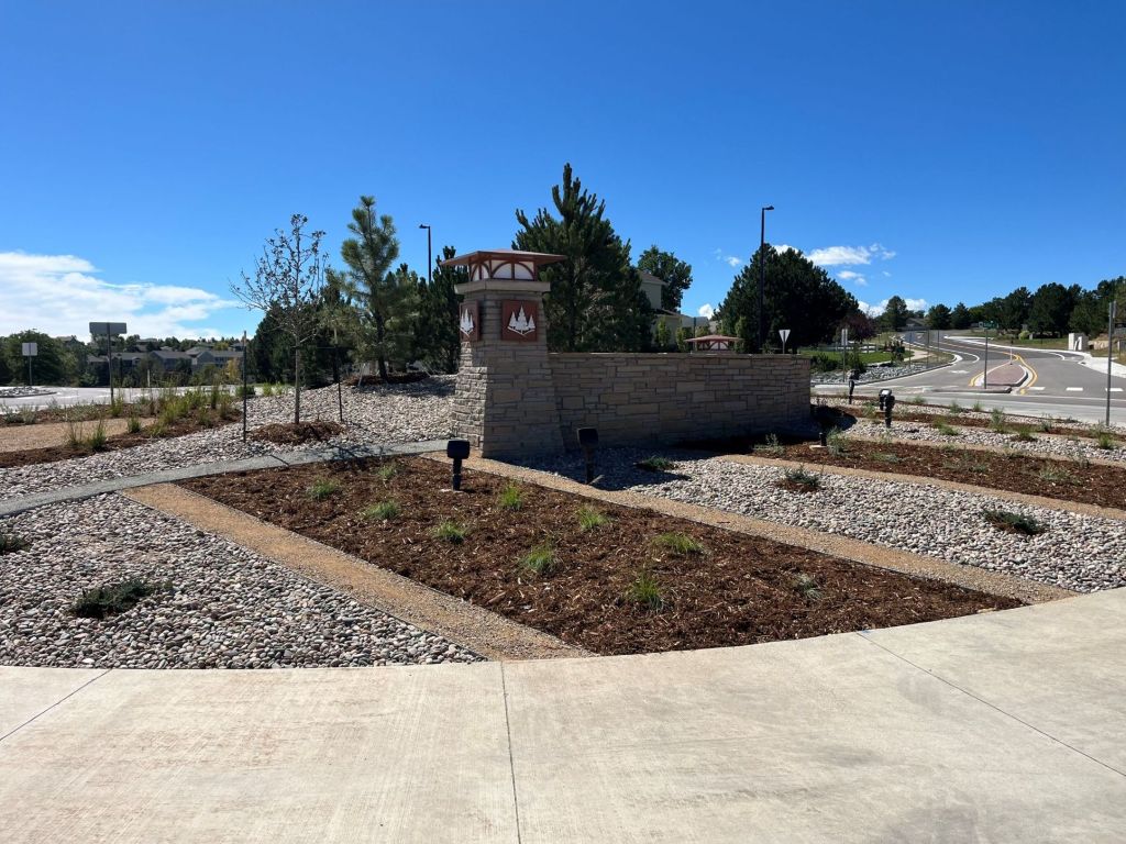 Monument and landscaping in a roundabout in a community.