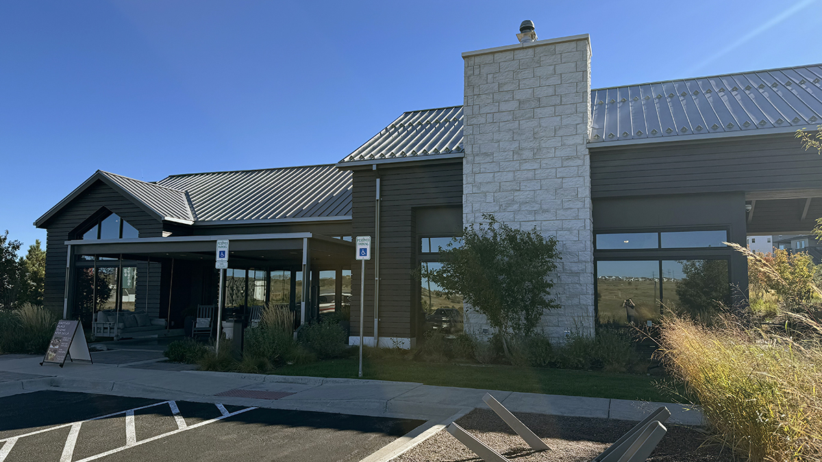 Outside facade of The Exchange Coffee House with clear blue skies in the background.